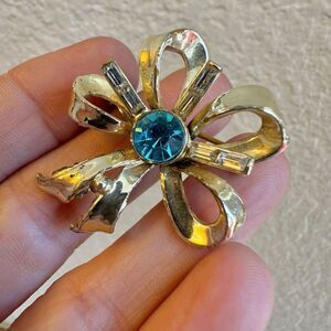 Coro vintage gold tone and blue rhinestone bow brooch